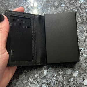 Sleek Black Men's Wallet with a holder for an Apple air tag